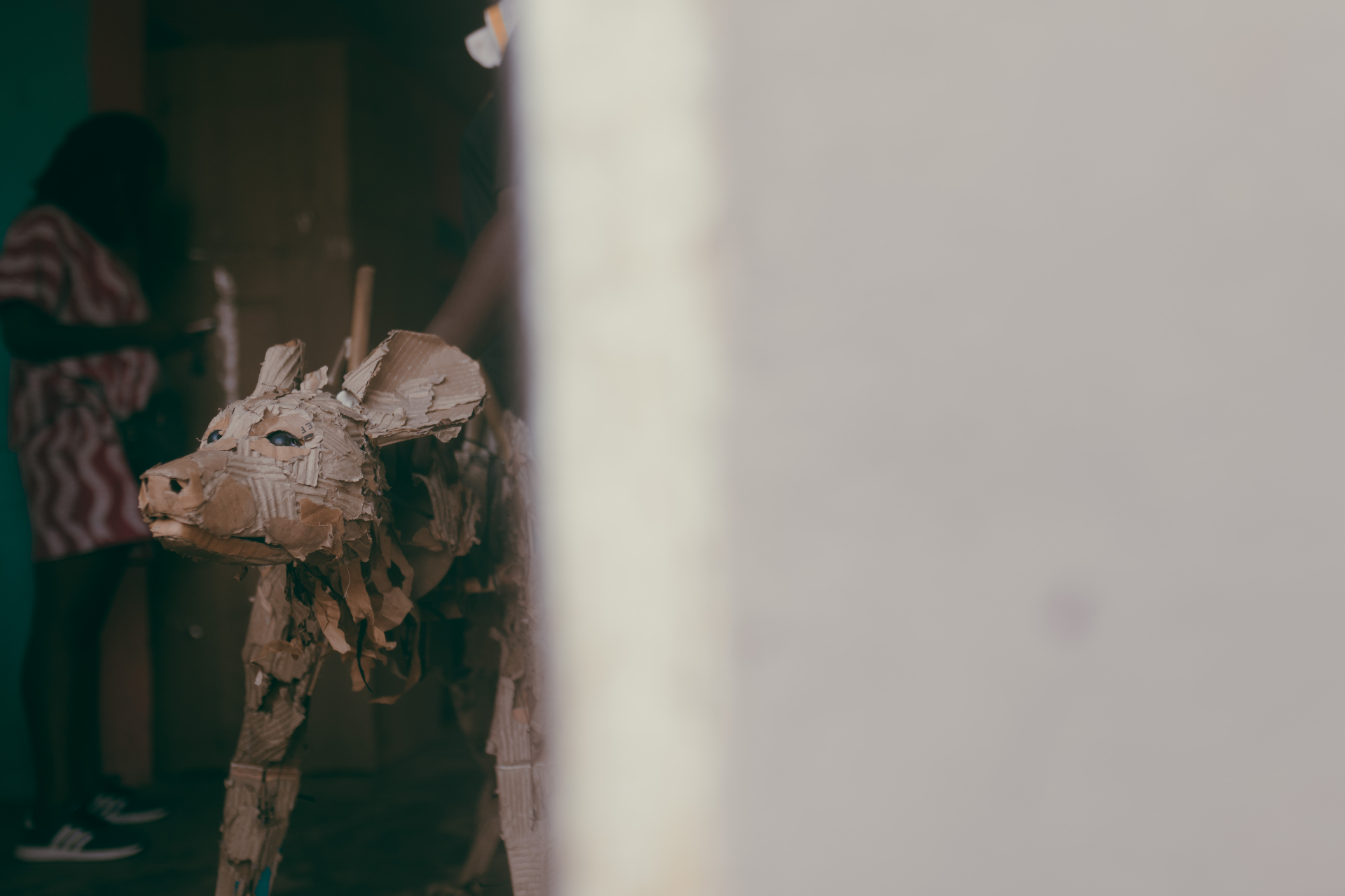 Cardboard animal puppet in a fabrication studio