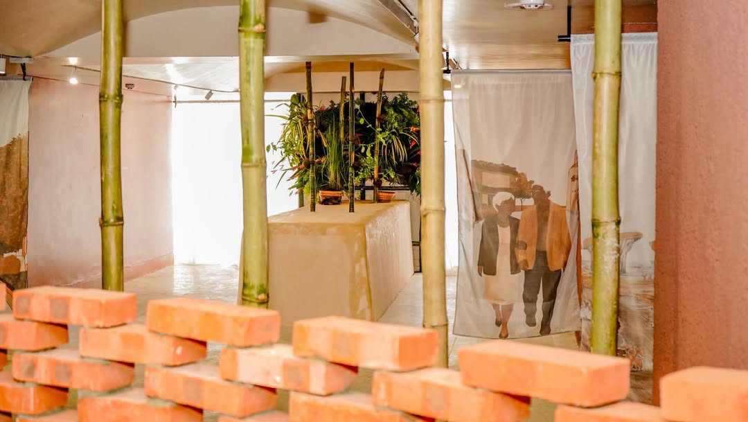 Close-up of the MatriAér Lab bamboo, brick and plant altar with figurative textile hangings at CCA Lagos